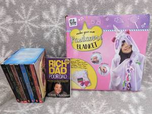 lot 23 image: Used assorted books, well read, pandacorn blanket toy new in box