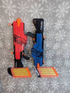 lot 33 image: Nerf gun Rival guns ( red and Blue ) with extra ammo storage belt clip