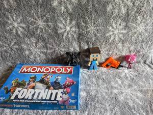 lot 154 image: Mincraft figures, Monopoly Frotnite, and assorted toys
