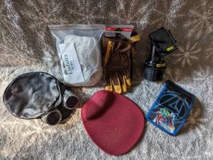 lot 207 image: Wig, Steam punk hat, mouse pad, Avangers wallet, Kinco work gloves, and cell phone holder