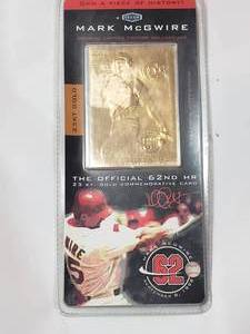 lot 11 image: Unopened Mark McGwire Official 62nd HR 23kt Gold commemorative Card