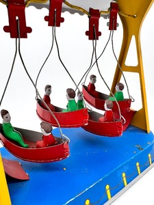 lot 110 image: Vintage Colorful Wind-Up Tin  Metal Toy Swing