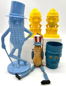 lot 136 image: Nuts Vintage Planters Plastic Bank, Jointed Uncle Sam Peanut ornament, Humpty Dumpty Plastic Salt & Pepper Shakers and CAPTAIN KANGAROO Cup