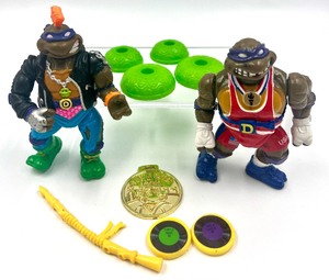lot 140 image: Vintage TEENAGE MUTANT NINJA TURTLES -Rockn Roll Punker Don 1991, Olympics Power Lifting Don Sports Donatello, 1992 and accessories
