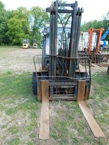 lot 23 image: Nissan 6000lb Diesel Forklift with Cab