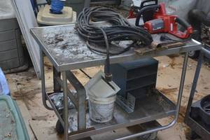 lot 25 image: Steel wheeled cart with contents included