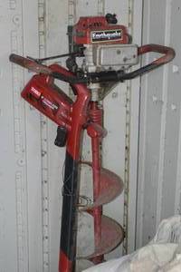 lot 59 image: Ice Auger, Toro Trimmer and crate of chains