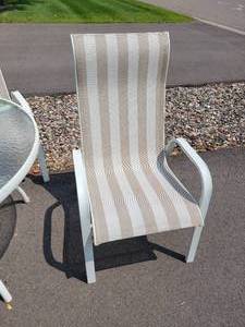lot 47 image: Rugged Four Chair Patio Dining Set