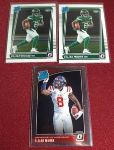 lot 94 image: (3) Optic Elijah Moore Rated Rookie Cards