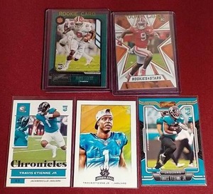 lot 100 image: (5) Travis Etienne Rookie Cards