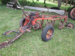 Hydraulic cultivating implement (bu...