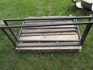 Pair of metal frames with a Neveren...