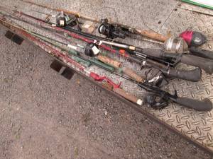 Lot of assorted style fishing poles...