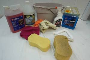 lot 219 image: Bucket of rags & Car liquids