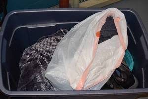 lot 81 image: Bin of Boots and Cloths