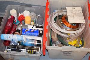 lot 87 image: 2 Bins of Aerosols and Hoses