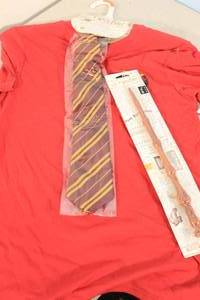 lot 156 image: Harry Potter Gryffindor Tee Small with Tie  Albus Dumbledore 13 Replica Wand