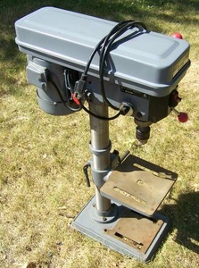 lot 5 image: Master Mechanic table top drill press, model #ZJ4116QC.