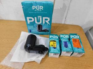 lot 74 image: PUR PLUS Faucet Mount Filtration System, Black With 3 Extra filters