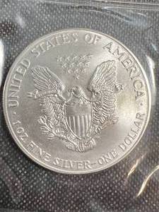 lot 57 image: 1986 AMERICAN SILVER EAGLE 1 TROY OZ .999 FINE SILVER