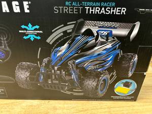 lot 102 image: SHARPER IMAGE RC- ALL-TERRAIN RACER STREET THRASHER