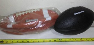 lot 555 image: Footballs (2). Snap-on and Madden