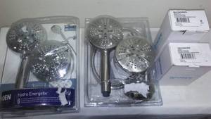 lot 611 image: Moen Shower heads and toilet paper holders.