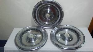 lot 705 image: Buick Royal Hubcaps.