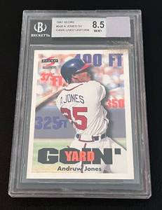lot 56 image: 1997 Score Andruw Jones Goin Yard Game Used Uniform #500 Beckett Graded 8.5 NM-MT Baseball Card