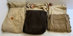 lot 91 image: Group Including 3 Wrangler Overalls Size XL (2New With Tags) (1Lightly Used), 1 Tan Overall (44-46) 1 Dark Brown Overall (Size 50) 1 L.L. Bean Pants (40x32)