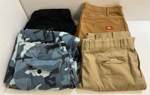 lot 93 image: Group Of Misc. Pants 1Light Tan (40x32)  1 Dark Tan Dickies (40x32) , 1 XL Regular Camo, 1 42x32 Black Dress Pants
