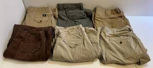 lot 94 image: Group Of Misc. Sized Dress PantsOutdoor 1 Light Tan (38 x 34), 2 Gray & Tan(38 x 33), 1 Tan (40x34), 1 Dark Brown (40x30) 1 Tan Shorts Size (40)