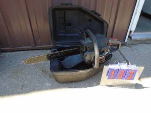 lot 103 image: Craftsman 18 chainsaw with case. Good used condition. As shown.