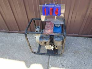 lot 104 image: Gas powered transfer pump. Used condition. Company upgraded. As shown.