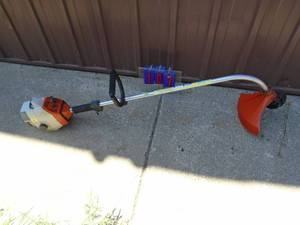 lot 107 image: Stihl weed trimmer. Used condition. Tested & works.  As shown.