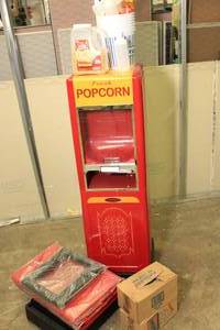 lot 51 image: Vintage Appliance Company Popcorn Machine w Bags, Buckets, Bottles, Theater Butter, Popping Corn, and Replacement Parts for Base