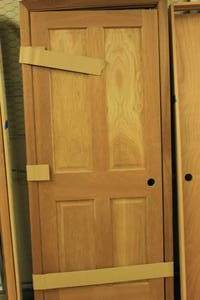 lot 61 image: Wooden Door with Hinges, Solid Core w Trim Attached