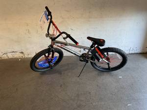 lot 24 image: Mongoose Index 2.0 Silver 20 Inch Freestyle Bike