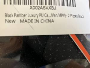 lot 312 image: Black Panther Pair of Luxury Black PU Leather Car Seat Protectors for front seats