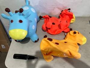 lot 329 image: Set of 3 Inflatable Bouncy Giraffe Hoppers