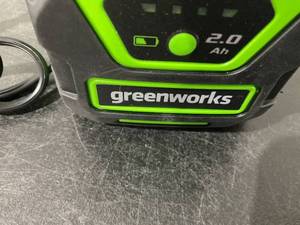 lot 390 image: Greenworks 40V 20 Inch Cordless Battery Pole Hedge Trimmer with 2.0 Ah Battery & Charger