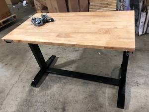 lot 51 image: Husky 46 in. W x 24 in. D Steel Adjustable Height Solid Wood Top Workbench Table in Black Customer Returns See Pictures