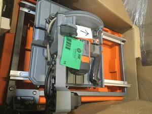 lot 15 image: RIDGID 9 Amp 7 in. Blade Corded Wet Tile Saw with Stand Have damage see Pictures no tested