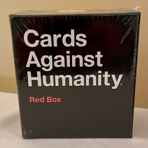 lot 307 image: Red and Blue Boxes of Card Against Humanity