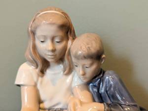 lot 69 image: Royal Copenhagen Boy and Girl Porcelain Figurine 4670