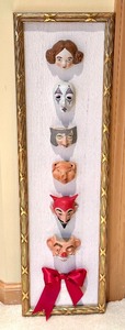 lot 24 image: Fun Framed Miniature Character Faces