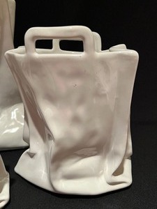 lot 44 image: Three Decorative Porcelain Abstract Paper Bag Figurines