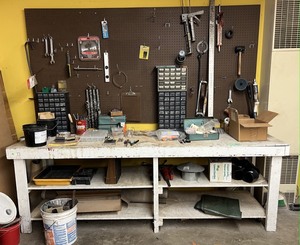 lot 4340 image: Work benchpegboard contents