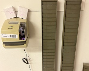lot 7199 image: Time clock & racks