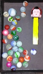 lot 786 image: Vintage Marbles and Pinocchio Pez Dispenser.